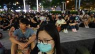 People gather outside of the Legislative Council building to protest against police brutality in Hong Kong on June 23, 2019.  AFP / HECTOR RETAMAL
