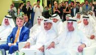 H E Ali bin Ahmed Al Kuwari (second right), Minister of Commerce and Industry; and Hussain Ibrahim Al Fardan (right), and other dignitaries during the opening of Jaguar Land Rover sales showroom in Lusail City on Monday. 