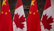 In this file photo taken on December 5, 2017 shows Canadian and Chinese flags taken prior to a meeting with Canada's Prime Minister Justin Trudeau and China's President Xi Jinping at the Diaoyutai State Guesthouse in Beijing. AFP / Fred Dufour
 