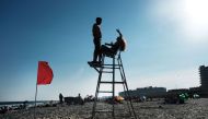 People enjoy an afternoon at the beach on the last day of school in New York on June 26, 2019 in New York City.  Spencer Platt/Getty Images/AFP