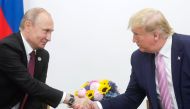 US President Donald Trump (R) meets Russian President Vladimir Putin (L) on the first day of the G20 summit in Osaka, Japan on June 28, 2019. (Kremlin Press Office/Anadolu Agency)