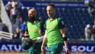 South Africa's captain Faf du Plessis (R) and South Africa's Hashim Amla leave the field at close of play during the 2019 Cricket World Cup group stage match between Sri Lanka and South Africa at the Riverside Ground, in Chester-le-Street, northeast Engla