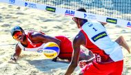 Qatar’s Cherif Younousse and Ahmed Tijan in action during their Pool D clash against Italy’s Enrico Rossi and Adrian Ignacio Carambula on the opening day of the  FIVB Beach Volleyball World Championships in Hamburg, Germany, yesterday.