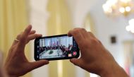 A journalist takes a picture as Iran's top nuclear negotiator Abbas Araqchi and Secretary General of the European External Action Service (EEAS) Helga Schmit attend a meeting of the JCPOA Joint Commission in Vienna, Austria, June 28, 2019. Reuters/Leonhar