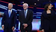 Democratic US 2020 election presidential candidates former Vice President Joe Biden, Senator Bernie Sanders and Senator Kamala Harris pose before the start of the second US 2020 presidential election Democratic candidates debate in Miami, June 27, 2019. R