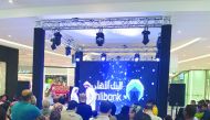 An Ahlibank official announcing the second winner of its QR1m Al Rabeh Savings Scheme prize at the Doha Festival City Mall on Thursday. 