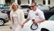 Navy Special Operations Chief Edward Gallagher walks into military court with his wife Andrea Gallagher June 24, 2019 in San Diego, California. Chief Gallagher is on trial for war crimes for shooting of unarmed civilians in Iraq in 2017, including a schoo