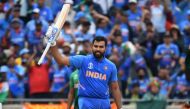 India's Rohit Sharma celebrates making his century during the 2019 Cricket World Cup group stage match between Bangladesh and India at Edgbaston in Birmingham, central England, on July 2, 2019. AFP / Paul Ellis
