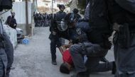 Israeli forces are seen trying to take some Palestinians into custody after tension risen between Israeli forces and Palestinians, following the funeral ceremony of Palestinian youth Mohammad Samir, 20, who was shot with live ammunition in the heart and t