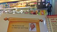 This photo taken on June 28, 2019 shows the image of P. Rajagopal, founder of the Saravana Bhavan food chain, on a menu at one of the popular restaurants in Chennai./ AFP / ARUN SANKAR 