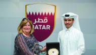 The Secretary-General of the Association of National Olympic Committees, Gunilla Lindberg receiving a memento from Secretary-General of Qatar Olympic Committee, Jassim bin Rashid Al Buainain yesterday.