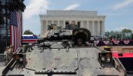 Members of the U.S. Army's 3rd Infantry Division, 1st Battalion, 64th Armored Regiment based at Fort Stewart, Georgia assist as a Bradley Fighting Vehicle is moved into place at the Lincoln Memorial ahead of a July Fourth celebration highlighting U.S. mil