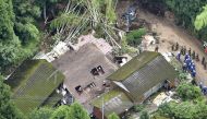 An aerial view shows rescue workers searching for a missing resident at a collapsed house due to a landslide caused by heavy rain in Soo, Kagoshima prefecture, southwestern Japan, July 4, 2019, in this photo taken by Kyodo. Mandatory credit Kyodo/via Reut