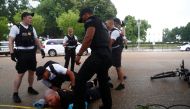 US Secret Service Uniformed Division officers detain a man in front of the White House during a Fourth of July Independence Day protest in Washington, July 4, 2019. Reuters/Eric Thayer