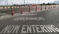 A 'Now Entering Government Property' sign is posted outside the main gate to Naval Air Weapons Station (NAWS) China Lake on July 7, 2019 in Ridgecrest, California.  Mario Tama/Getty Images/AFP 