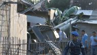 REPRESENTATIVE IMAGE: Investigators check the wreckage of an Indonesian military helicopter which crashed on July 8, 2016 into a suburban area just north of Yogyakarta, a major city on the main island of Java (AFP) 