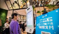 A customer tries Alipay's facial recognition payment solution Smile to Pay at new KPRO restaurant by  KFC in Hangzhou-Zhejiang province, China, September 1, 2017. Reuters