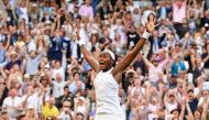 US player Cori Gauff celebrates beating Slovenia's Polona Hercog during their women's singles third round match on the fifth day of the 2019 Wimbledon Championships at The All England Lawn Tennis Club in Wimbledon, southwest London, on July 5, 2019. (AFP 