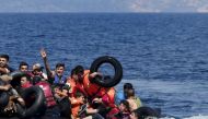 File photo opf drowning migrants being rescued on their way to Greece (Reuters) 