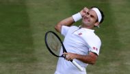 Switzerland's Roger Federer celebrates beating Spain's Rafael Nadal during their men's singles semi-final match on day 11 of the 2019 Wimbledon Championships at The All England Lawn Tennis Club in Wimbledon, southwest London, on July 12, 2019. AFP / Pool 