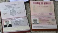 Domestic and foreign passports of Russian Andrey Mironov, and a passport of Italian photojournalist Andrea Rocchelli lie on display in Slaiansk, Ukraine. (Photo courtesy: cyprus-mail.com )  