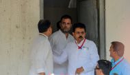 Former Congress President Rahul Gandhi (C) comes out of the Metropolitan Court premises in Ahmedabad on July 12, 2019. AFP / Sam Panthaky
