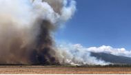 A wildfire is seen on the island of Maui, Hawaii, U.S., July 11, 2019 in this video grab taken from social media, July 12, 2019. John Sandbach Photography/Instagram@sandbachspics via REUTERS