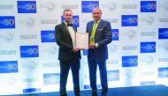 Bassel Gamal, Group CEO of QIB (right), receiving the award.