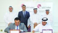 Sheikh Khalifa bin Jassim bin Mohammed Al Thani (right), Chairman of Qatar Chamber; and Abdul Razzaq Al Zuhairi of Iraqi Chambers of Commerce during the signing ceremony.
