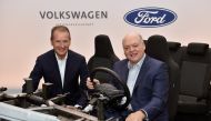 Volkswagen CEO Herbert Diess and Ford President and CEO Jim Hackett appear in a prototype vehicle after announcing a joint investment in Argo, a self-driving autonomous vehicle company in New York City, New York, U.S. July 12, 2019. Sam VarnHagen/via Reut