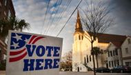 A 'vote here' sign stands outside a polling station across from the Emanuel African Methodist Episcopal Church in Charleston, South Carolina on February 20, 2016. AFP/Jim Watson