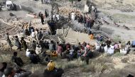 Pakistani miners gather outside the collapsed mine some 35 kilometres east of Quetta, the capital of oil and mineral rich Balochistan province on July 15, 2019. AFP