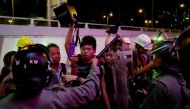 Riot police surround pro-democracy activist Joshua Wong (C) as they try to disperse protesters after a march at Sha Tin District of East New Territories, in Hong Kong, China July 14, 2019. (REUTERS/Tyrone Siu)
