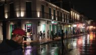 Visitors check out the attractions along Bourbon Street in the French Quarter despite rainfall from Hurricane Barry on July 12, 2019 in New Orleans, Louisiana. Scott Olson/Getty Images/AFP 
