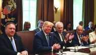 US President Donald Trump and others applaud outgoing Secretary of Labor Alexander Acosta as they participate in a Cabinet meeting at the White House on July 16, 2019 in Washington,DC. AFP / Nicholas Kamm