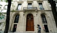 A man walks past the front door of the upper east side home of Jeffrey Epstein in New York, US, July 8, 2019. Reuters/Carlo Allegri