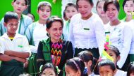 Myanmar's State Counsellor Aung San Suu Kyi attends a ceremony with teachers and students for a new school in Kawhmu on July 18, 2019. AFP 