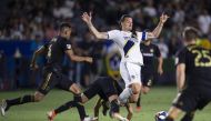  LA Galaxy forward Zlatan Ibrahimovic (9) is tripped up by Los Angeles FC midfielder Eduard Atuesta (20) while battling for the ball during the second half at Dignity Health Sports Park. (Kelvin Kuo-USA TODAY Sports)