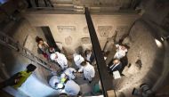 This handout photo made available by the Vatican Media on July 20, 2019 shows the opening of the ossuary at the Teutonic Cemetery in the Vatican as part of a probe into the case of Emanuela Orlandi, a teenager who disappeared in 1983 in one of Italy's dar