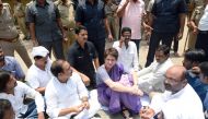 In this handout photo taken and released by the All India Congress Committee (AICC) Communication Department on July 19, 2019, Indian politician Priyanka Gandhi Vadra (C) participates ia a sitting in protest at Narayanpur District, Mirzapur, after being s