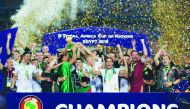 Algerian players and officials celebrate with the trophy after winning the 2019 Africa Cup of Nations title at the Cairo Stadium in Cairo, Egypt on Friday. Algeria sealed  their first Africa Cup of Nations (AFCON) title in 29 years, beating Senegal 1-0.