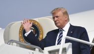 US President Donald Trump steps off Air Force One upon arrival at Morristown Municipal Airport in Morristown, New Jersey en route Bedminster, New Jersey on July 19, 2019. Trump is heading to his golf resort in Bedminster, New Jersey to attend a fundraiser