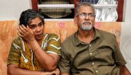 Deena with her husband Pappachan T V, parents of Dijo Pappachan, one of the crew members of British-flagged vessel owned by Stena Bulk, seized by Iran, cries as she watches television news at their home in Kochi, India, July 21, 2019.  Reuters/Sivaram V 