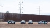 In this file photo taken on April 5, 2019 US Customs and Border Patrol cars are seen near the border wall between the United States and Mexico in Calexico, California. (AFP / SAUL LOEB)