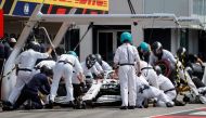 ercedes' British driver Lewis Hamilton sits inside his car in the pit stop during the qualifying session of the German Formula One Grand Prix at the Hockenheim racing circuit on July 27, 2019 in Hockenheim, southern Germany. (AFP / POOL / VALDRIN XHEMAJ)