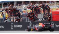 Red Bull's Max Verstappen crosses the line to win the race as Red Bull engineers celebrate (REUTERS/Kai Pfaffenbach)