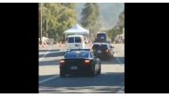 This screen grab taken from a handout video footage shows police cars arriving to the Gilroy garlic festival, 80 miles south of San Francisco, California on July 28, 2019. / AFP / Christopher Robinson Morales / Chris DELMAS