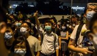 Protesters gather outside Kwai Chung police station in support of protesters detained with the charge of rioting during recent clashes in Hong Kong on July 30, 2019. (AFP / ISAAC LAWRENCE)