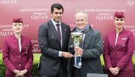 The President of Qatar and Asian Equestrian Federations, Hamad bin Abdulrahman Al Attiyah (second, left), presenting the Qatar Goodwood Stakes trophy to the owner of Stradivarius, Bjorn Nielsen, on the opening day of the QREC-sponsored Qatar Goodwood Fest