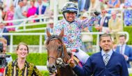 Jockey Khadijah Mellah celebrates after winning the Magnolia Cup on Haverland.